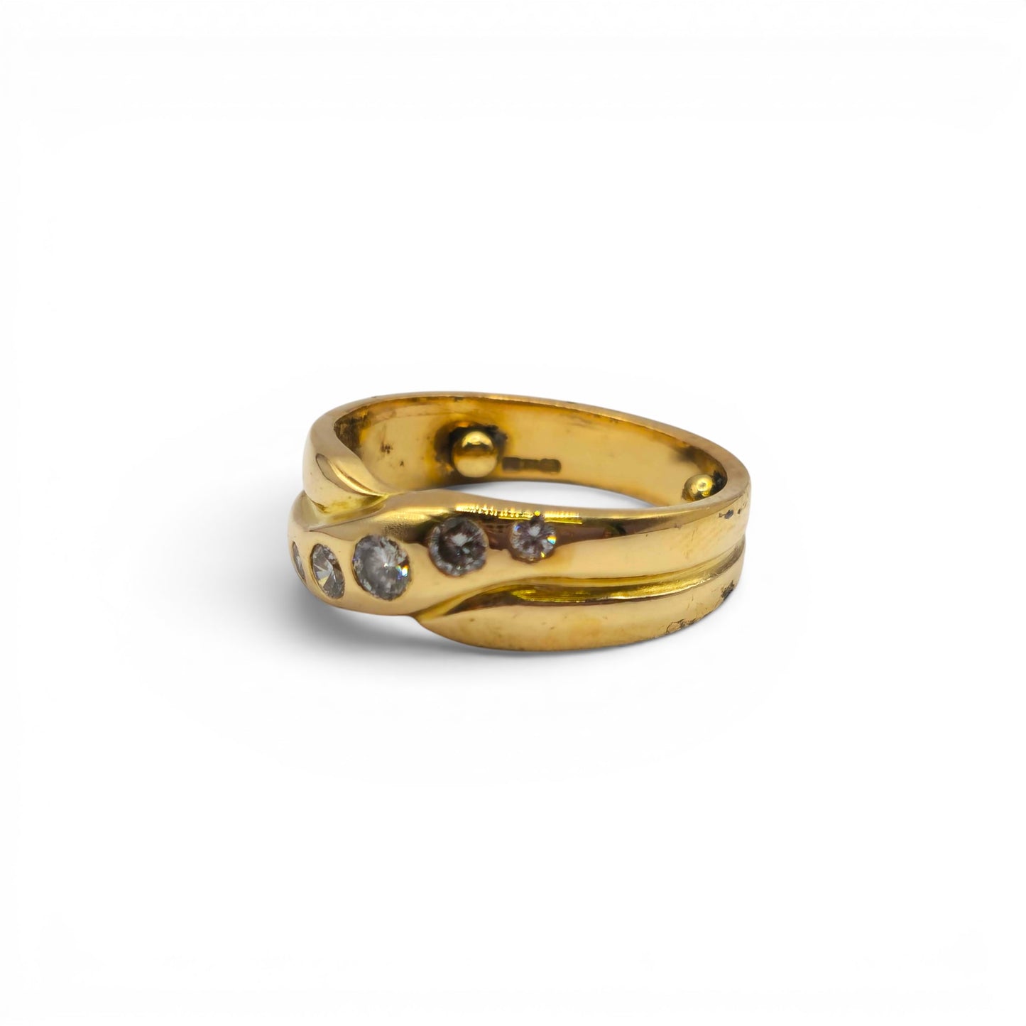 18ct yellow gold diamond crossover ring by Reeves and Sons featuring sparkling diamonds and a sleek, elegant design.