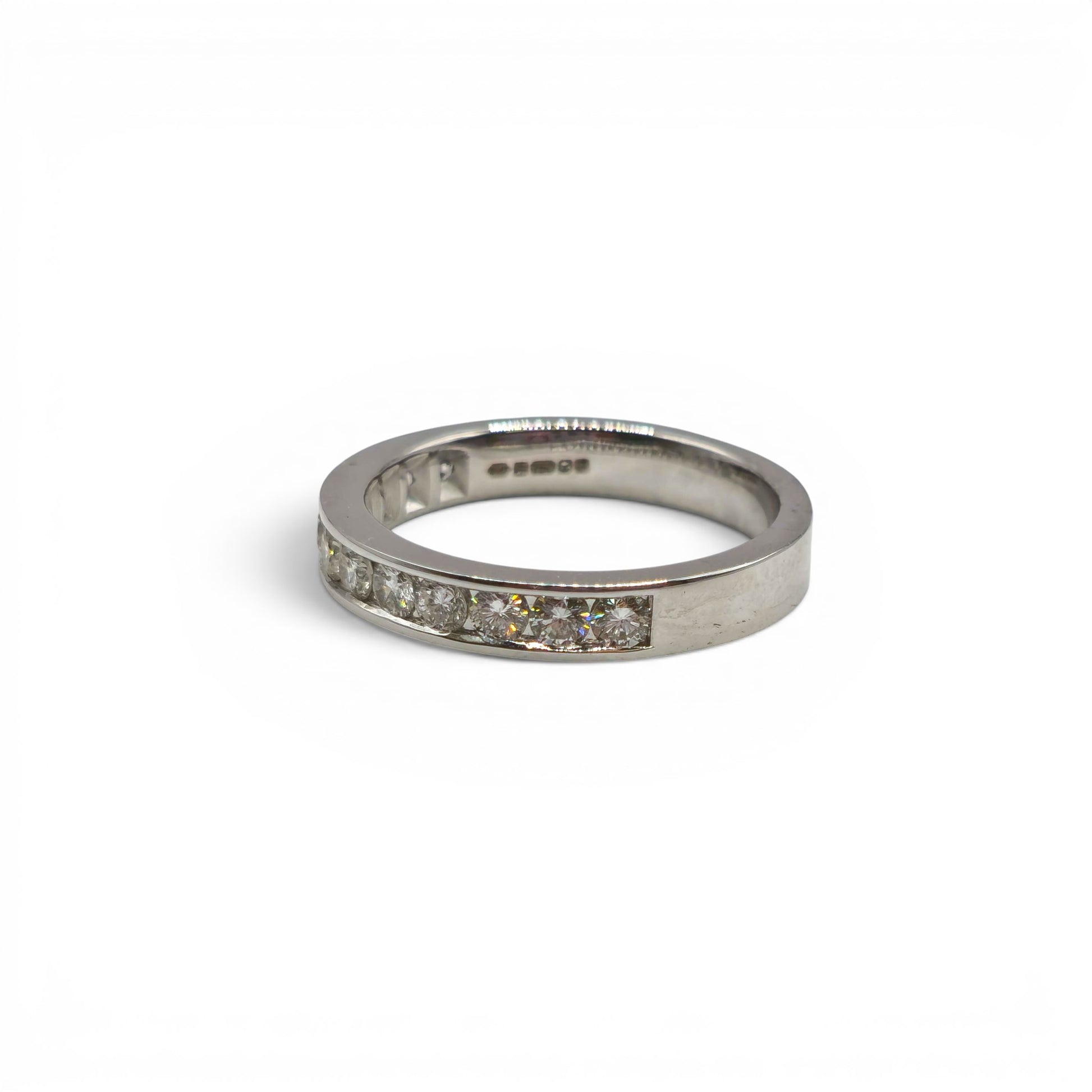 18ct white gold diamond half eternity ring with sparkling diamonds, crafted by Reeves and Sons.