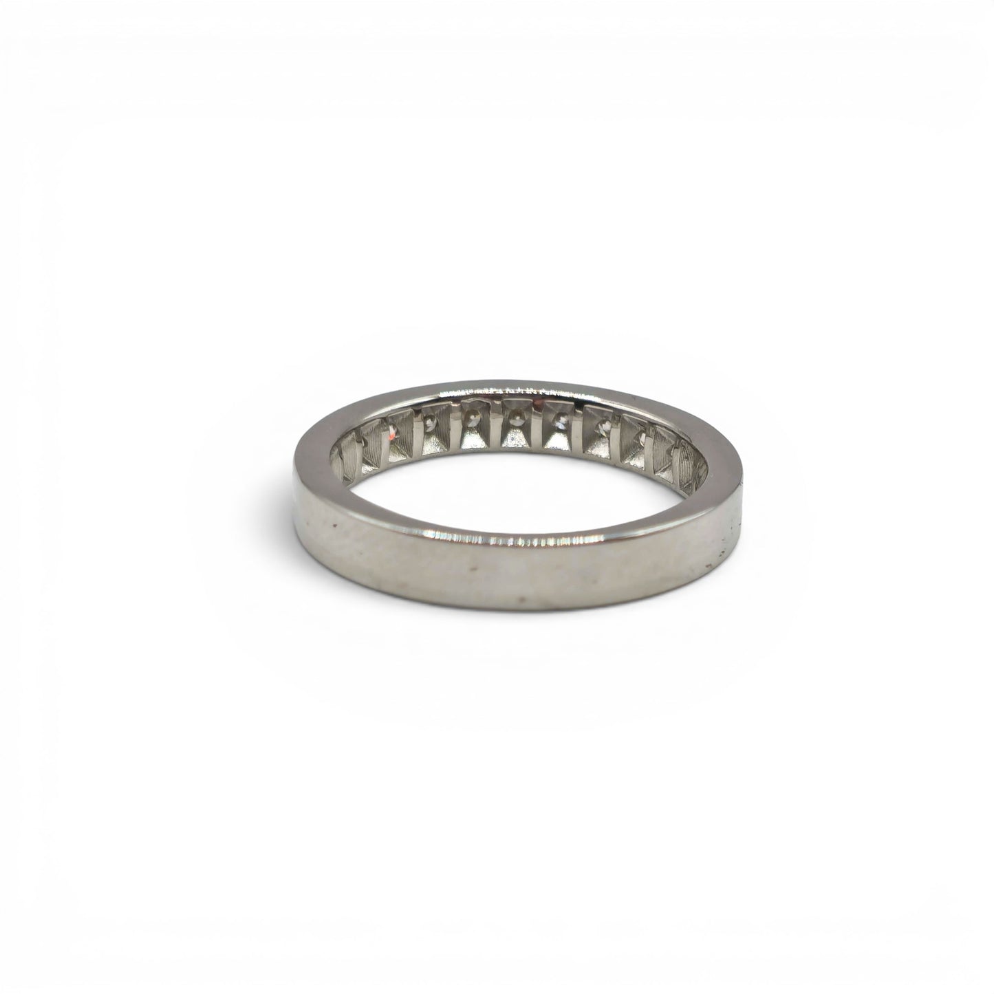 18ct white gold diamond half eternity ring with sparkling diamonds, showcasing Reeves and Sons craftsmanship and elegant design.
