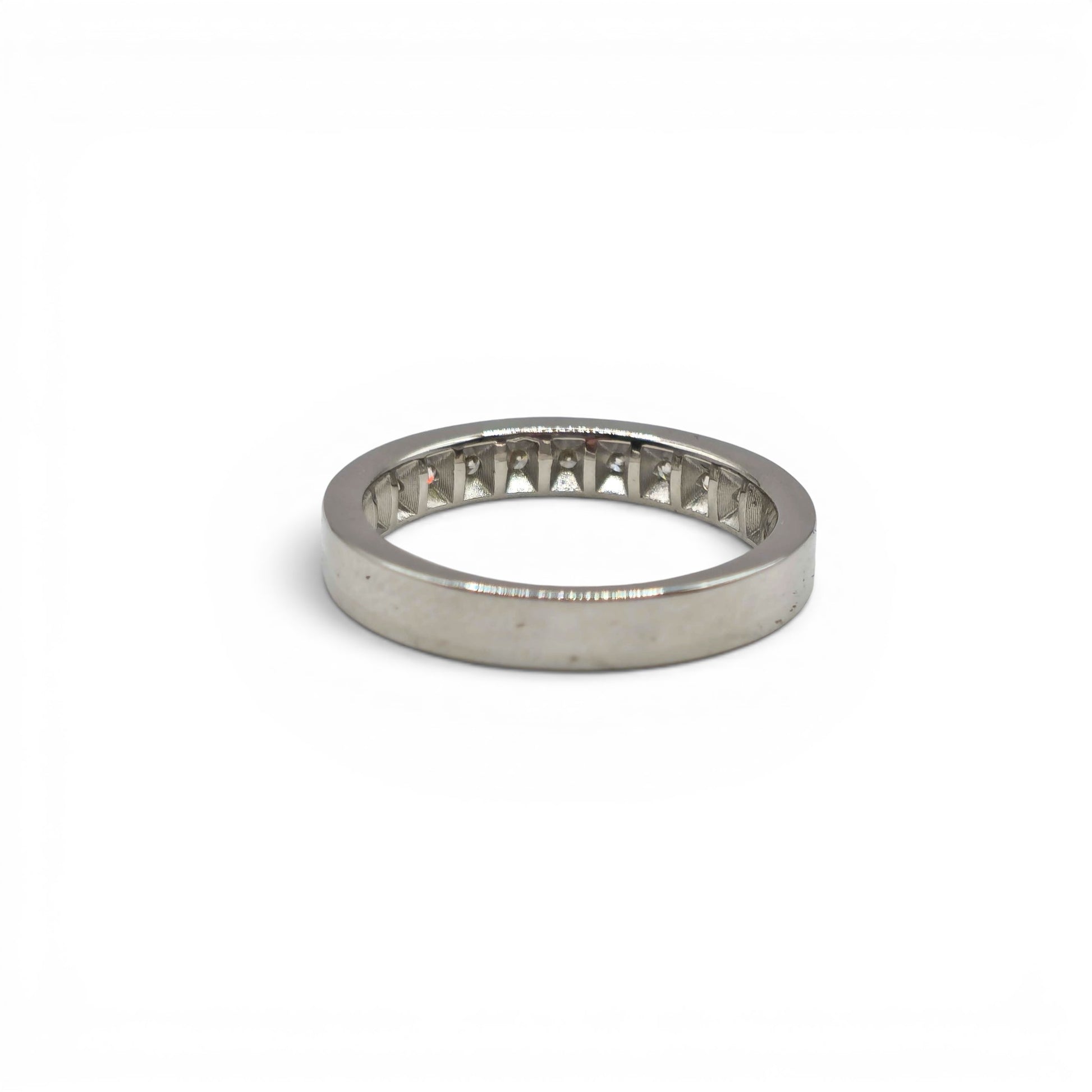 18ct white gold diamond half eternity ring with sparkling diamonds, showcasing Reeves and Sons craftsmanship and elegant design.