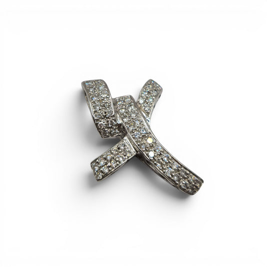 18ct white gold diamond abstract cross pendant by Reeves and Sons, featuring a modern design and sparkling diamonds.