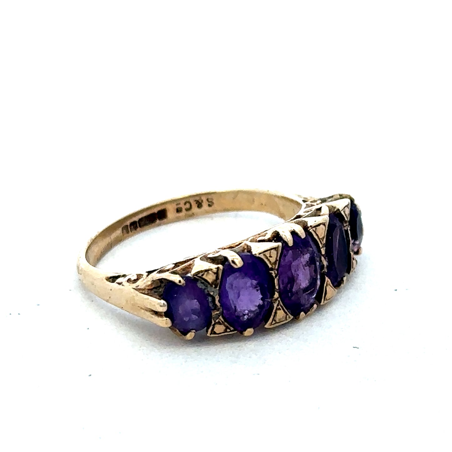 9ct yellow gold amethyst ring with a large purple gemstone, size N, from Reeves and Sons, displayed on a neutral background.