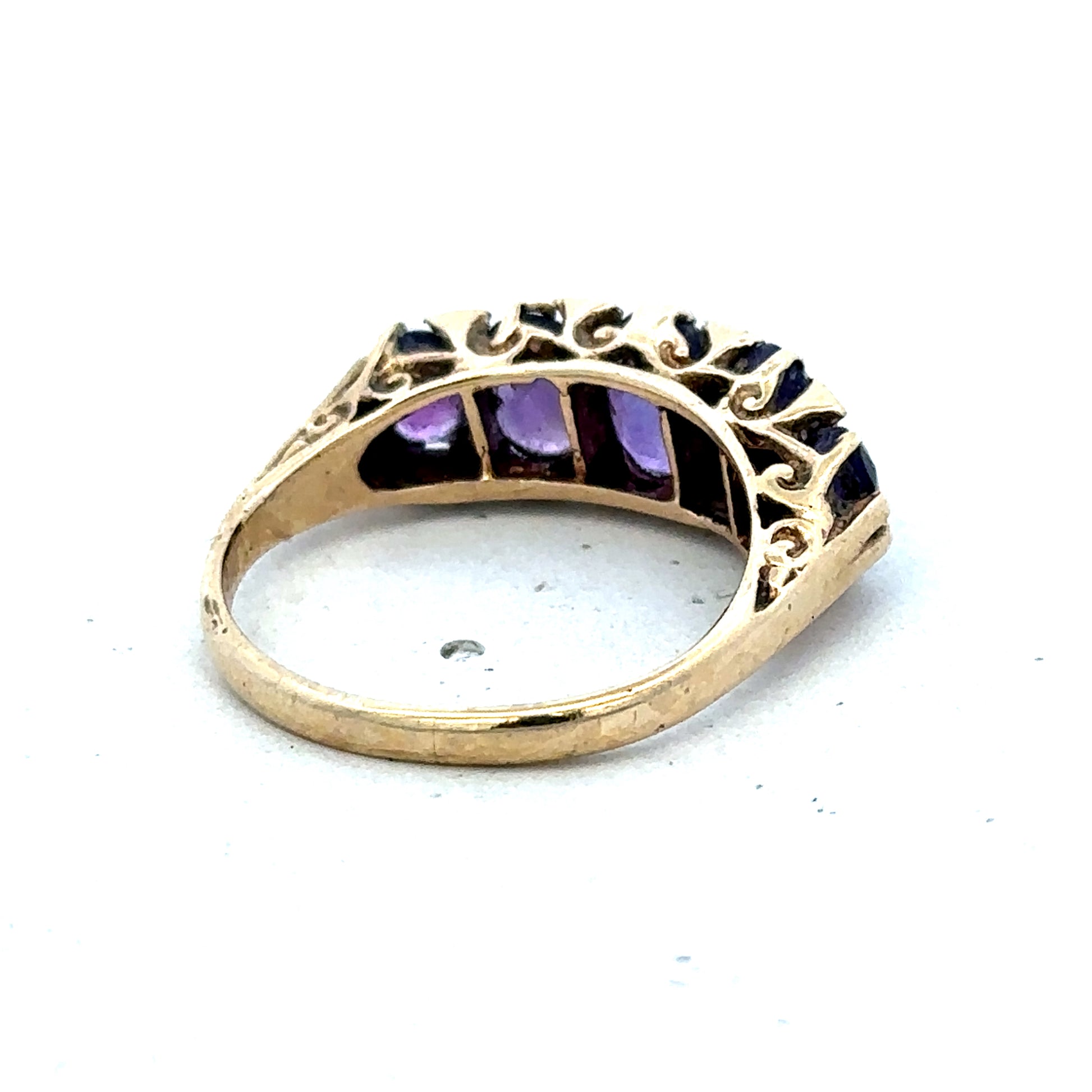 9ct yellow gold amethyst ring in size N with a round purple gemstone, crafted by Reeves and Sons.