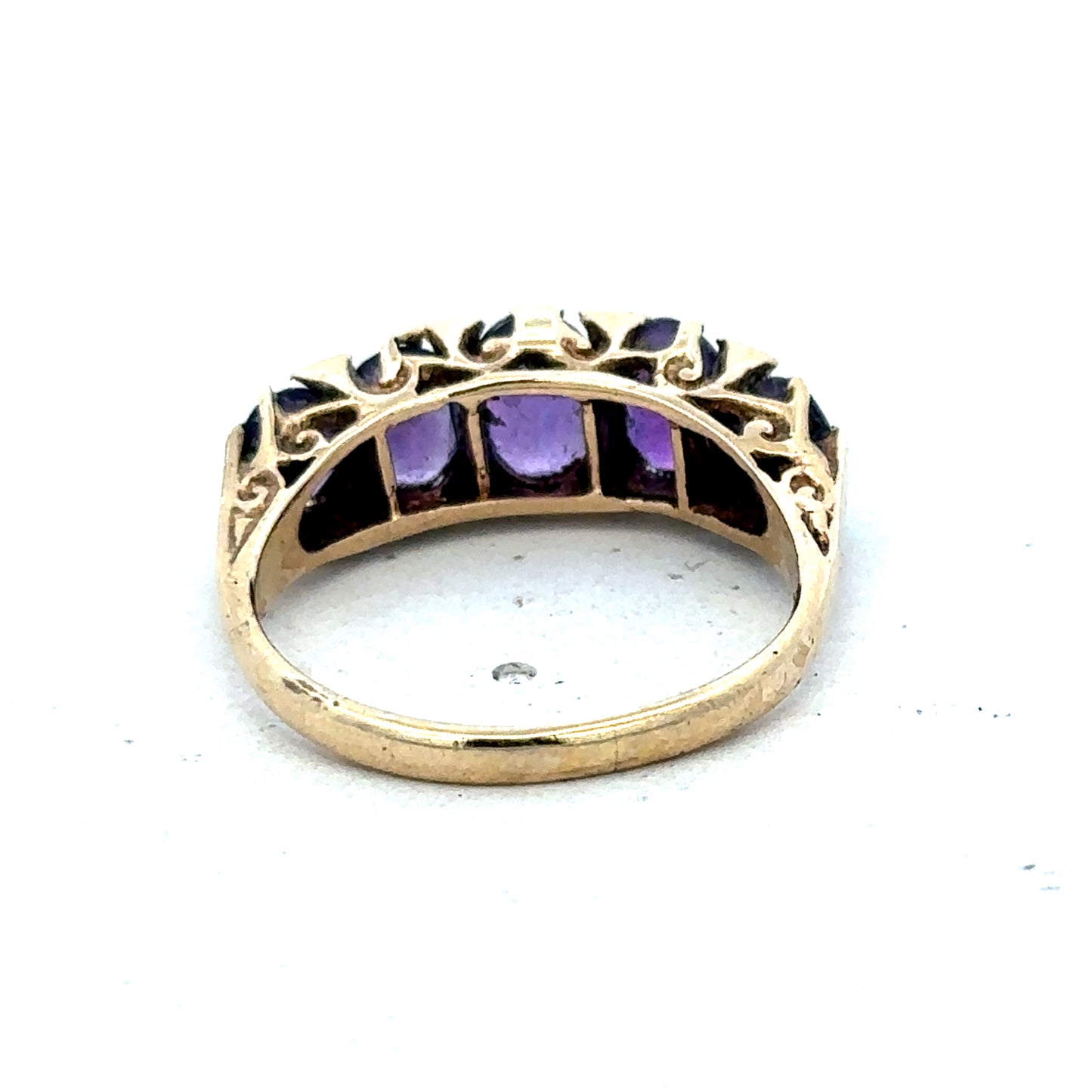 9ct yellow gold amethyst ring size N by Reeves and Sons, featuring a faceted purple gemstone in a classic setting