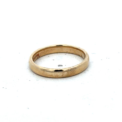 9ct yellow gold ring in size N with a smooth band, crafted by Reeves and Sons, shown in a detailed product image.