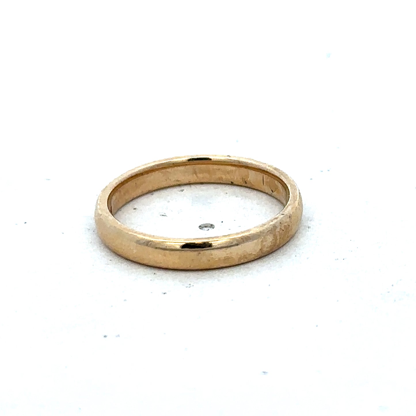 9ct yellow gold ring in size N with a smooth band, crafted by Reeves and Sons, displayed on a neutral background.