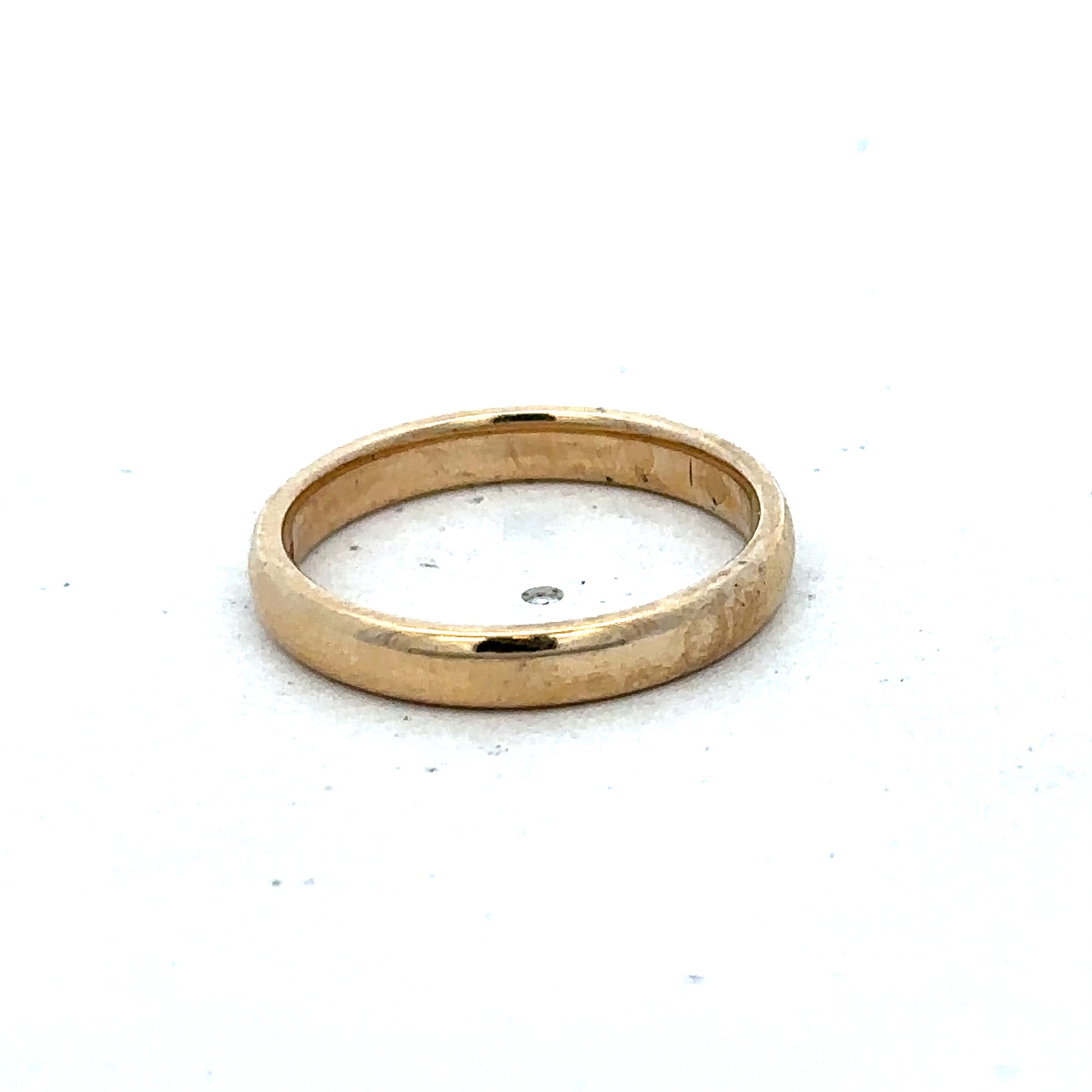 9ct yellow gold ring in size N with a smooth band, crafted by Reeves and Sons, displayed on a neutral background.