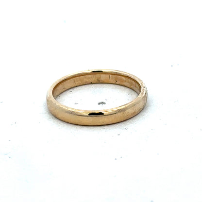 Gold ring in size N by Reeves and Sons, crafted in 9ct yellow gold with a simple, elegant band design.