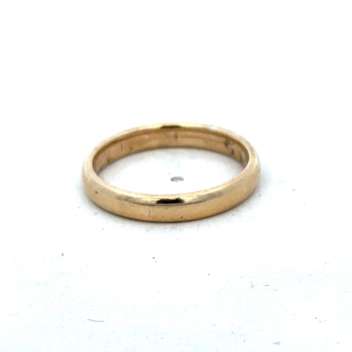 9ct yellow gold ring size N with a smooth band, crafted by Reeves and Sons, displayed on a neutral background.