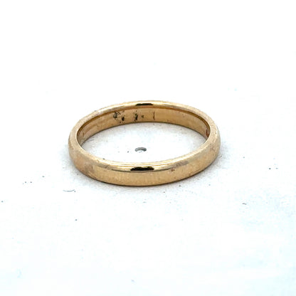 Yellow gold ring in size N by Reeves and Sons, showcasing a smooth band design with a polished finish.