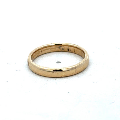 9ct yellow gold ring in size N by Reeves and Sons, featuring a polished band with subtle design details.