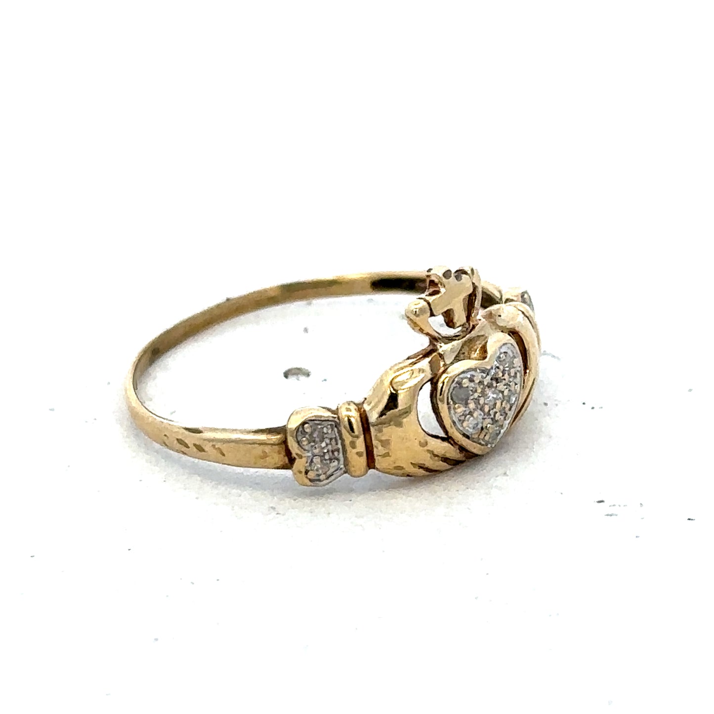 9ct yellow gold Claddagh ring in size V with detailed Celtic design, crafted by Reeves and Sons.
