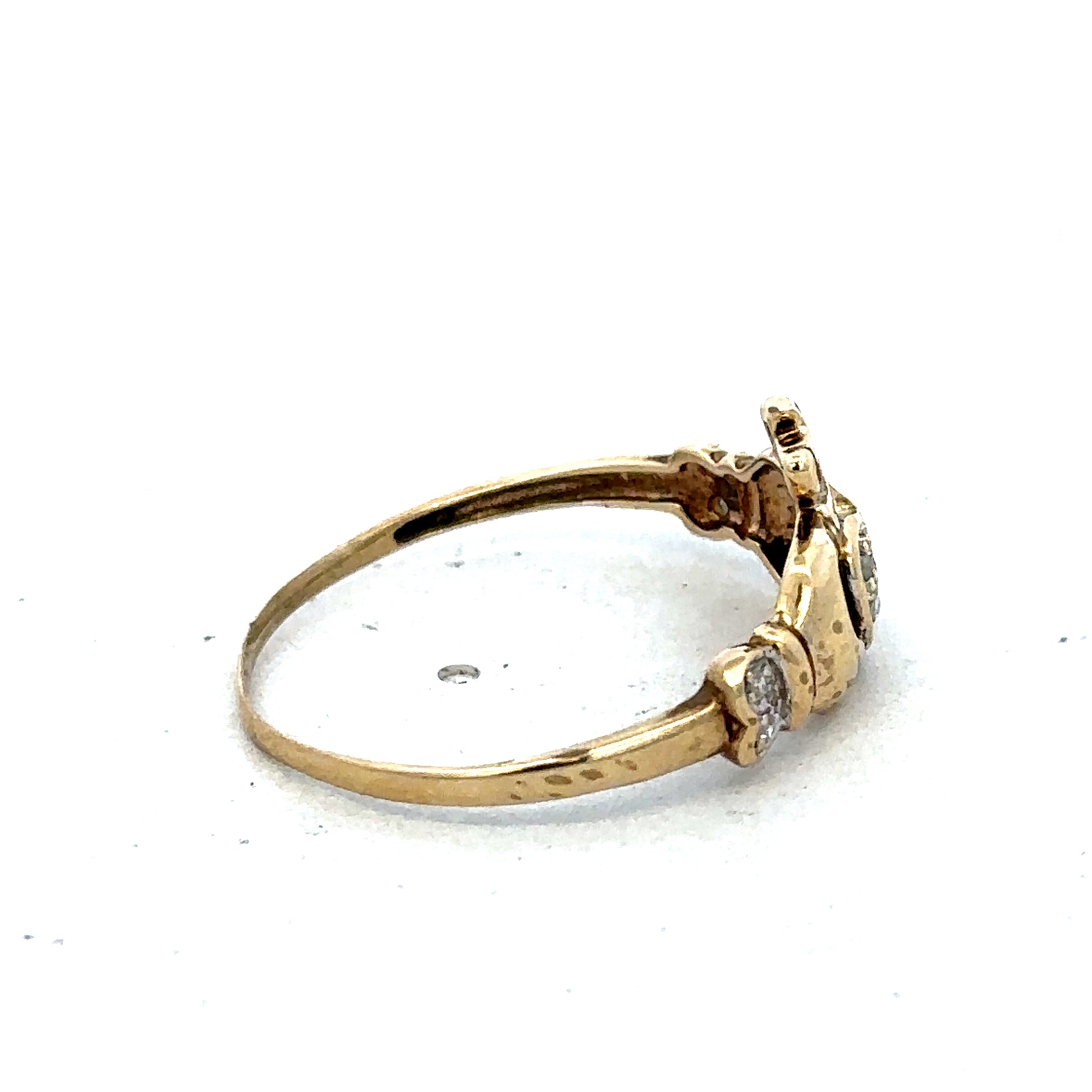 9ct yellow gold Claddagh ring in size V with detailed heart and crown design, crafted by Reeves and Sons.
