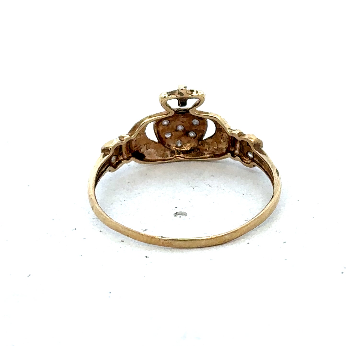 9ct yellow gold Claddagh ring in size V by Reeves and Sons, featuring intricate heart and hands design.