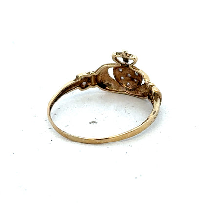 9ct yellow gold Claddagh ring in size V, featuring detailed craftsmanship and symbolic heart and hands design by Reeves and Sons.