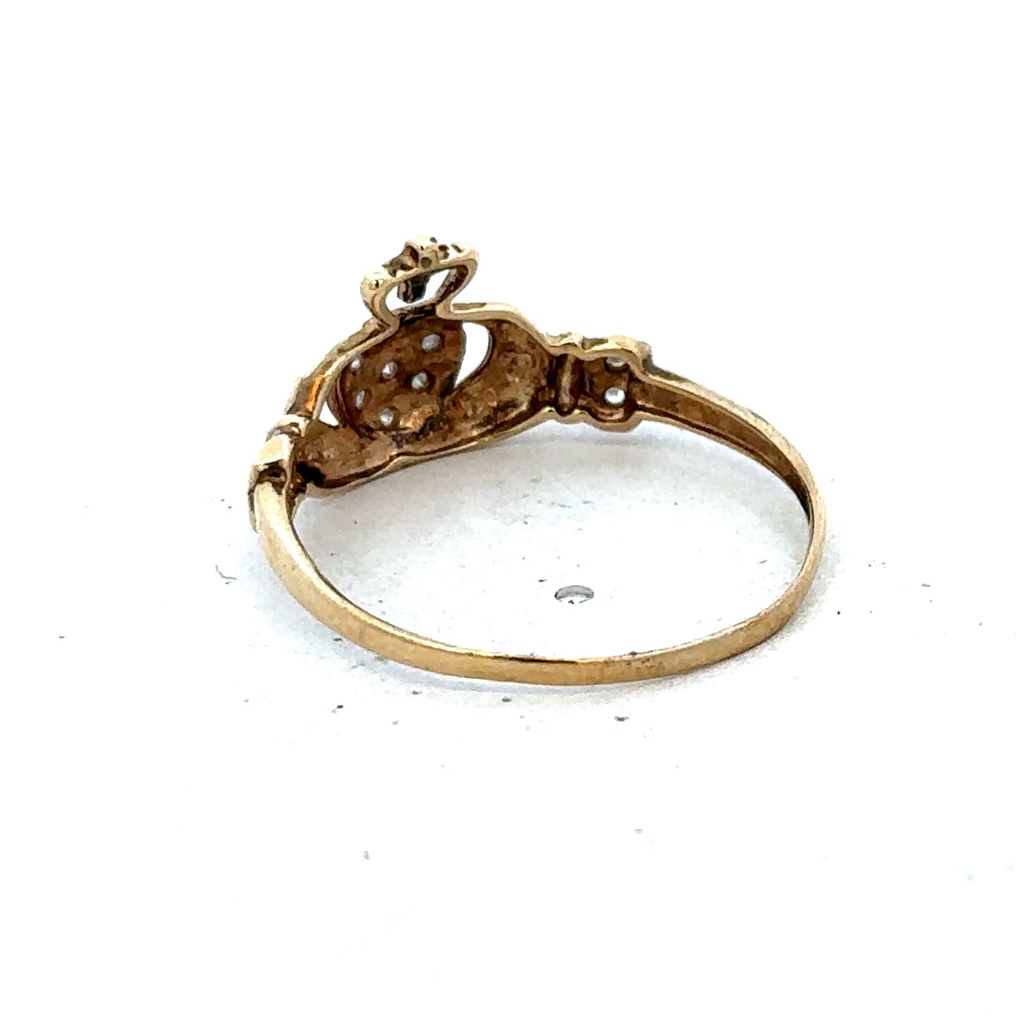 9ct yellow gold Claddagh ring in size V with detailed heart and crown design, crafted by Reeves and Sons.