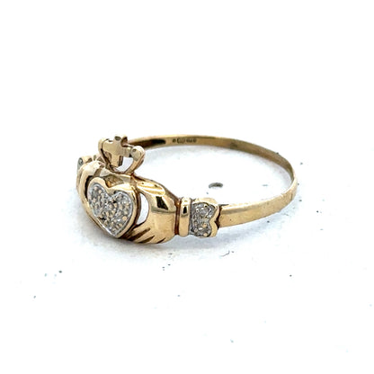 9ct yellow gold Claddagh ring in size V with detailed craftsmanship, featuring heart, hands, and crown design by Reeves and Sons