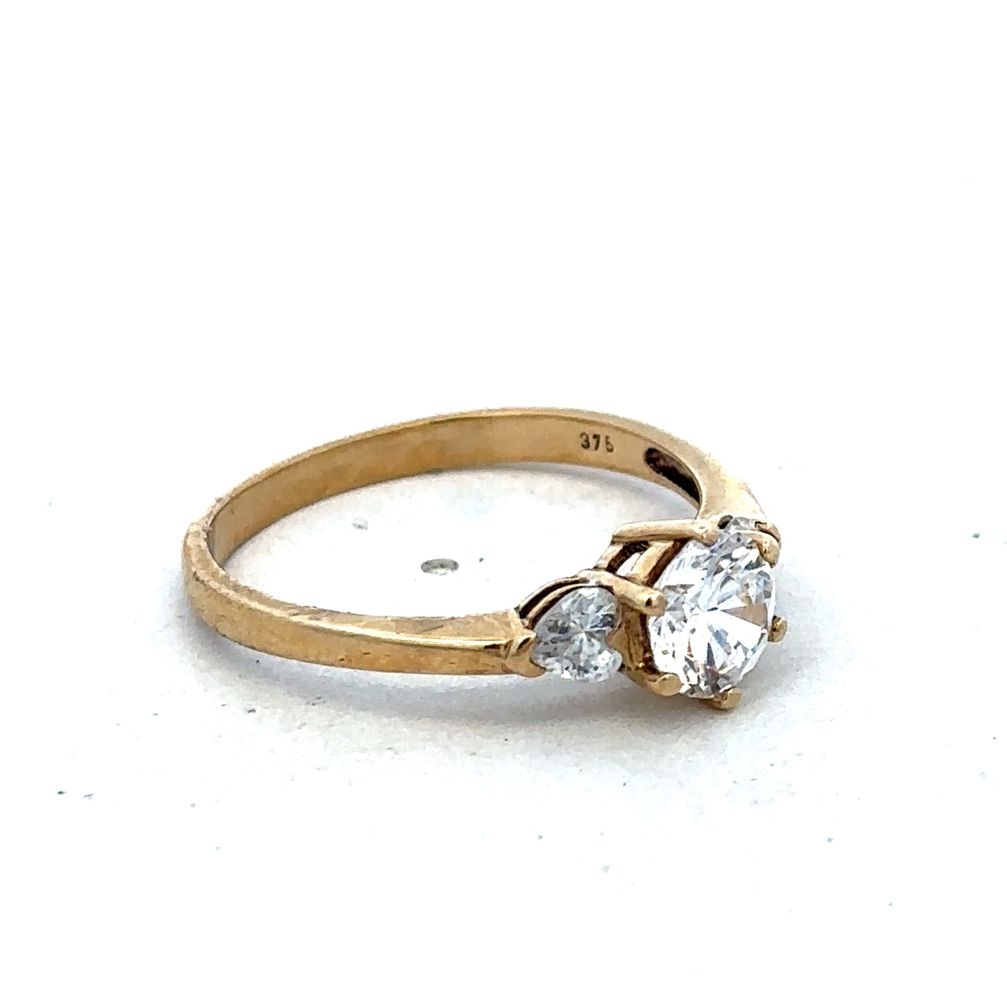 9ct yellow gold CZ ring in size U with a polished band, featuring sparkling cubic zirconia stones, by Reeves and Sons.