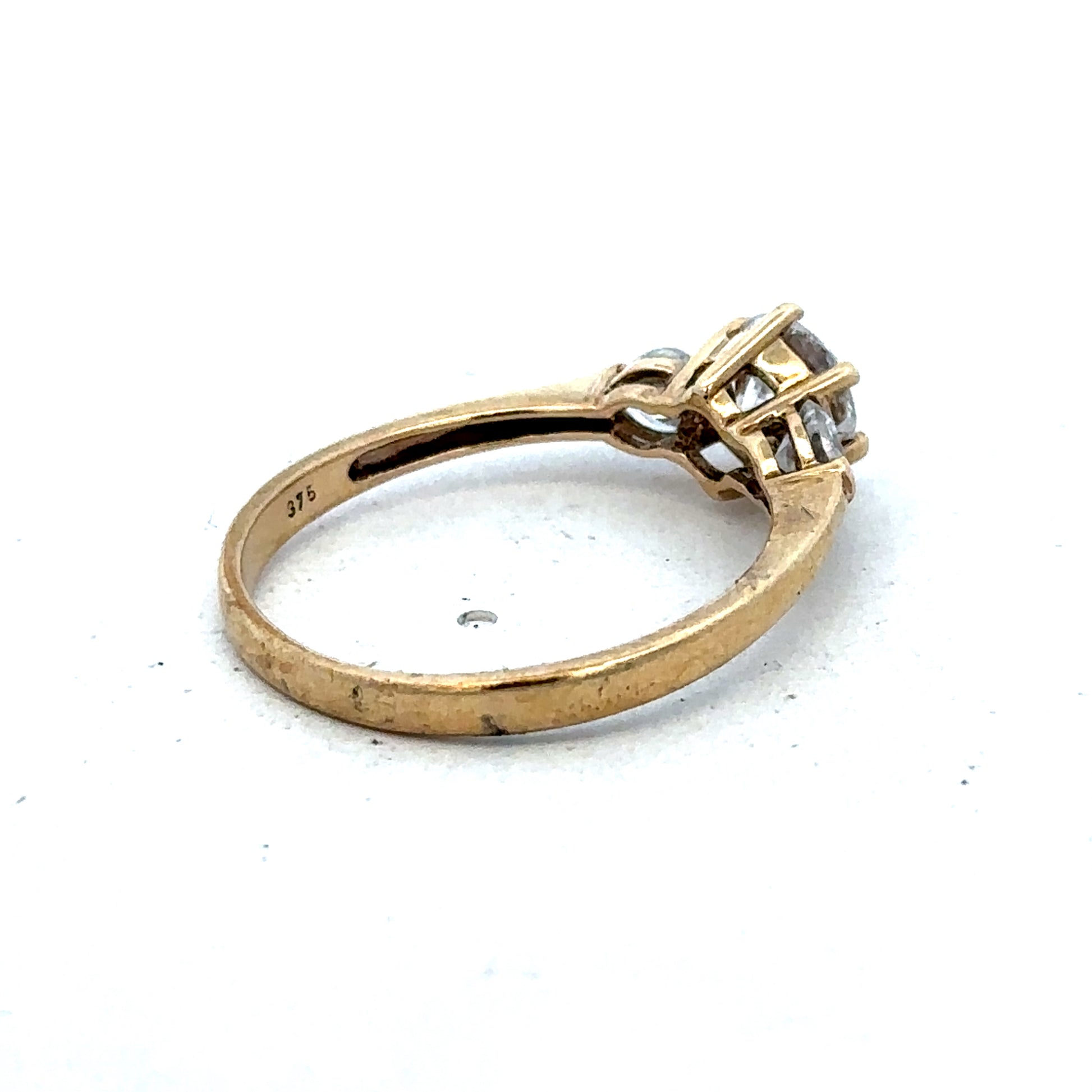 9ct yellow gold CZ ring in size U with a polished band, crafted by Reeves and Sons.