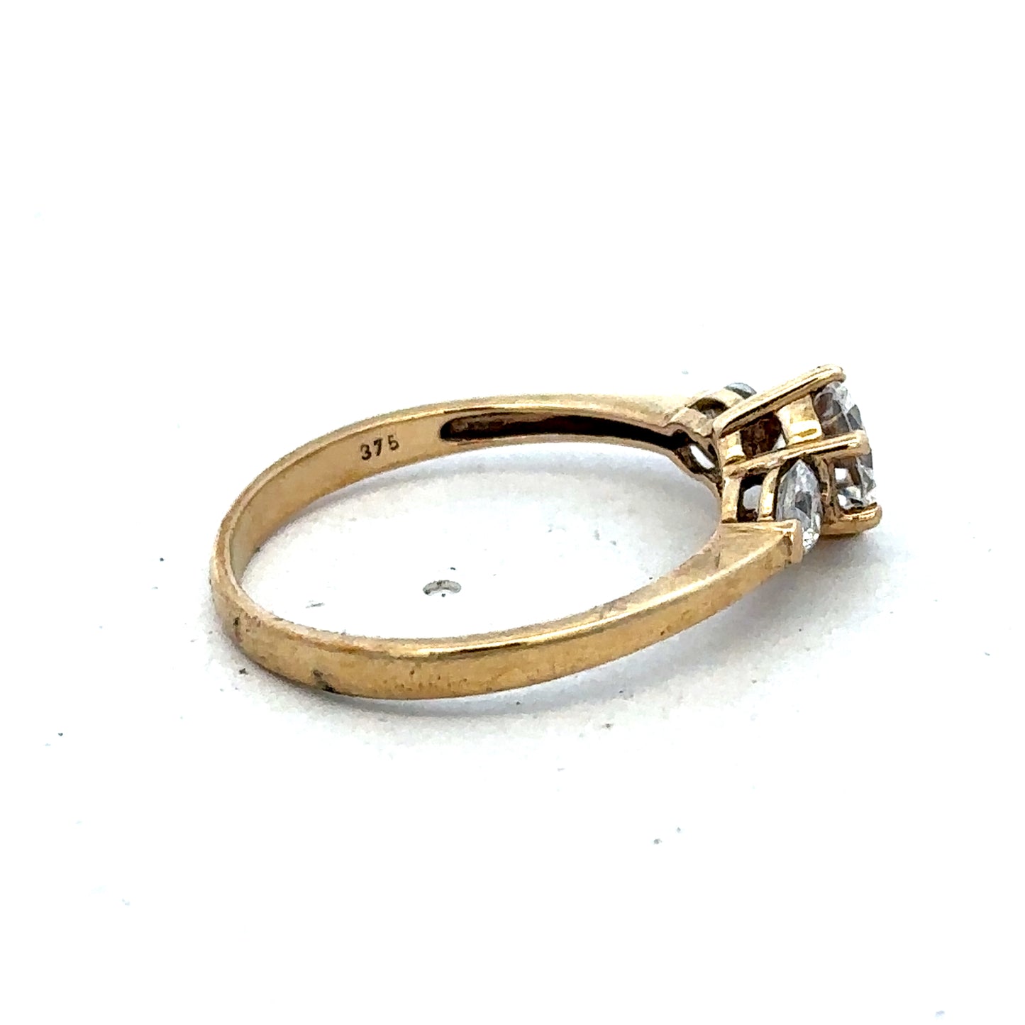 9ct yellow gold CZ ring in size U with a polished band, featuring sparkling cubic zirconia stones, by Reeves and Sons.