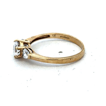 9ct yellow gold CZ ring in size U with sparkling cubic zirconia, crafted by Reeves and Sons, showcasing intricate design details.