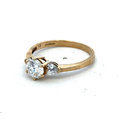 9ct yellow gold CZ ring in size U by Reeves and Sons, featuring a polished band and sparkling cubic zirconia stone.
