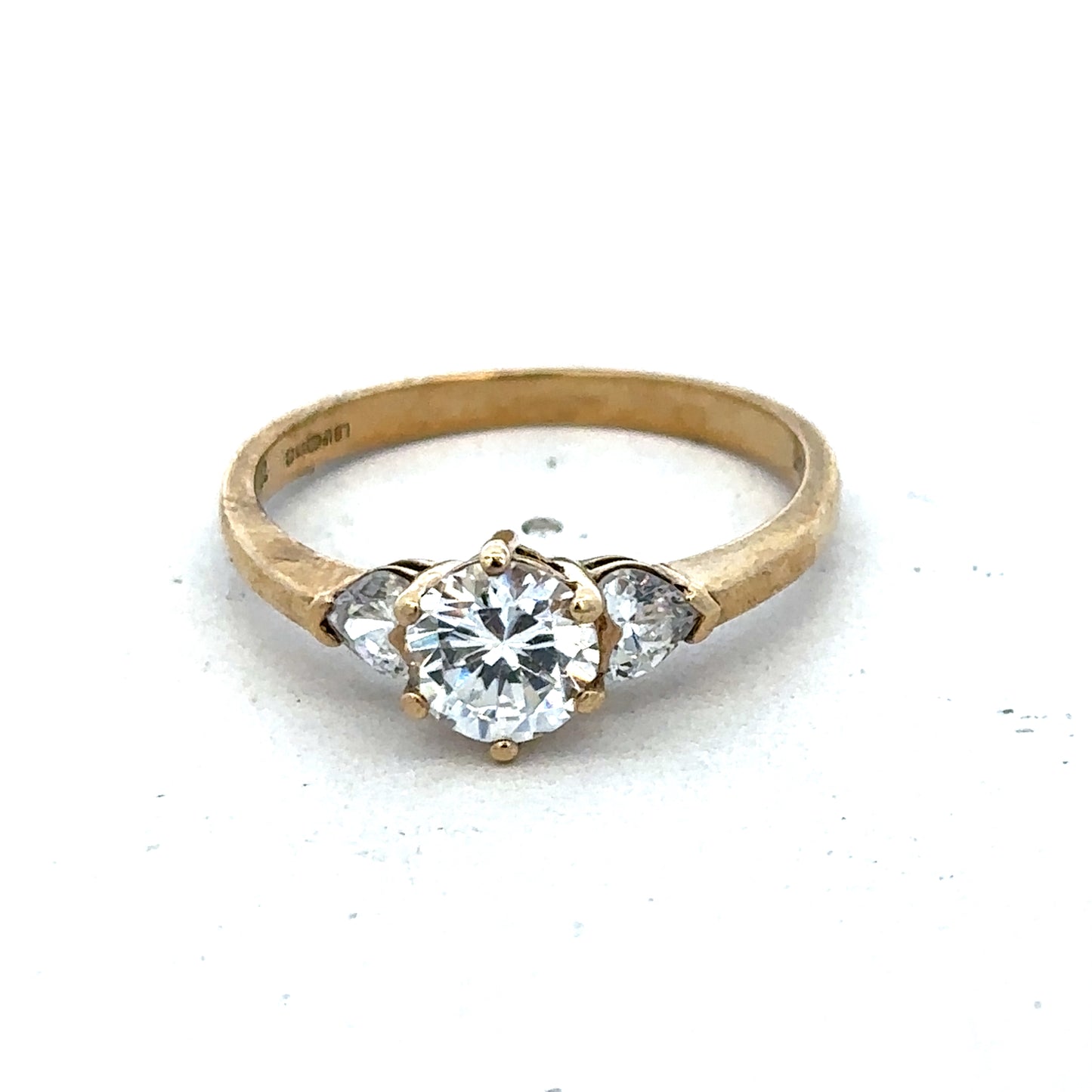 9ct yellow gold CZ ring size U by Reeves and Sons, featuring a sparkling cubic zirconia gemstone in a classic band design.