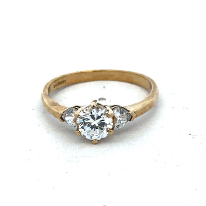 9ct yellow gold CZ ring size U by Reeves and Sons, featuring a sparkling cubic zirconia gemstone in a classic band design.