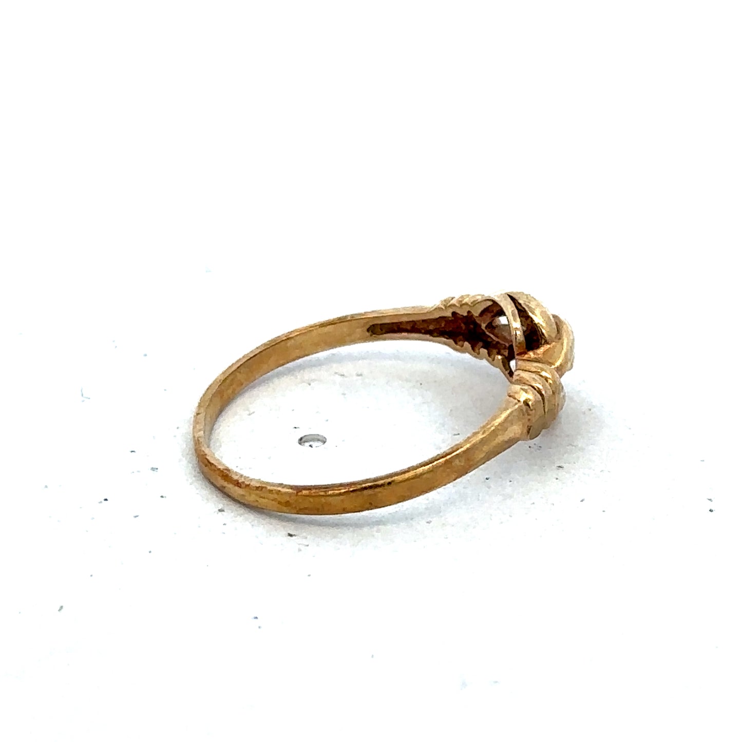 9ct yellow gold ring size N from Reeves and Sons, showcasing a polished band with a smooth finish.