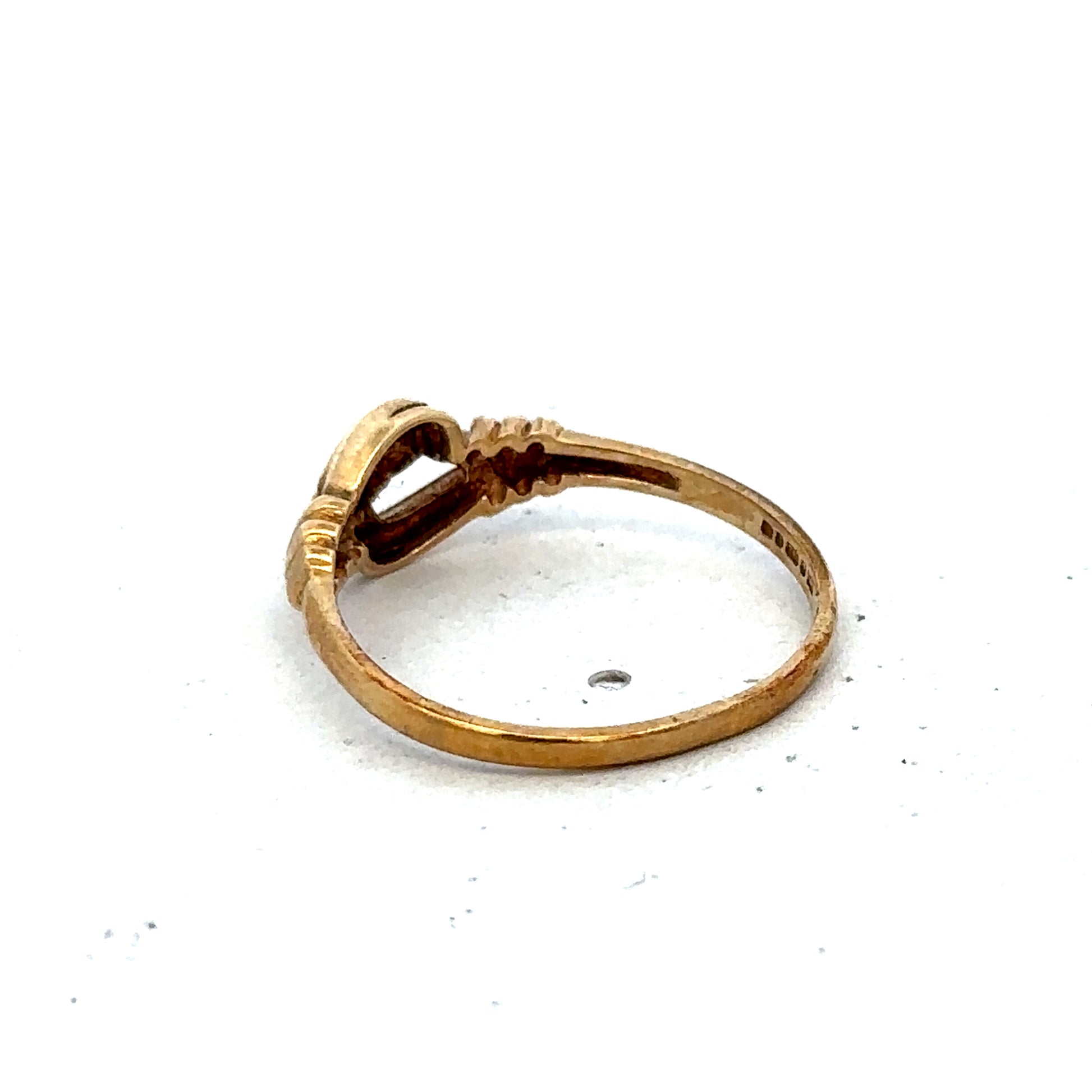 9ct yellow gold ring in size N from Reeves and Sons, showcasing a smooth band with a polished finish.