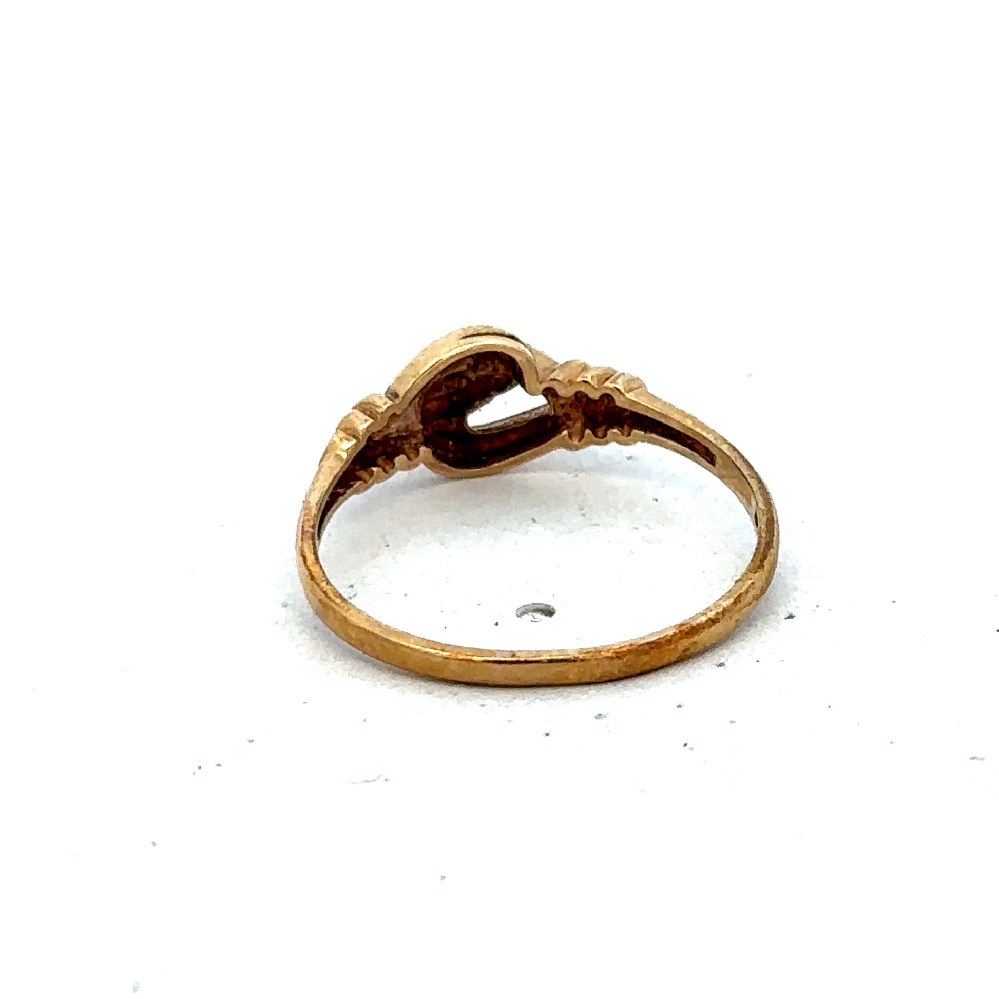 9ct yellow gold ring size N by Reeves and Sons, showcasing a smooth polished band on a white background.