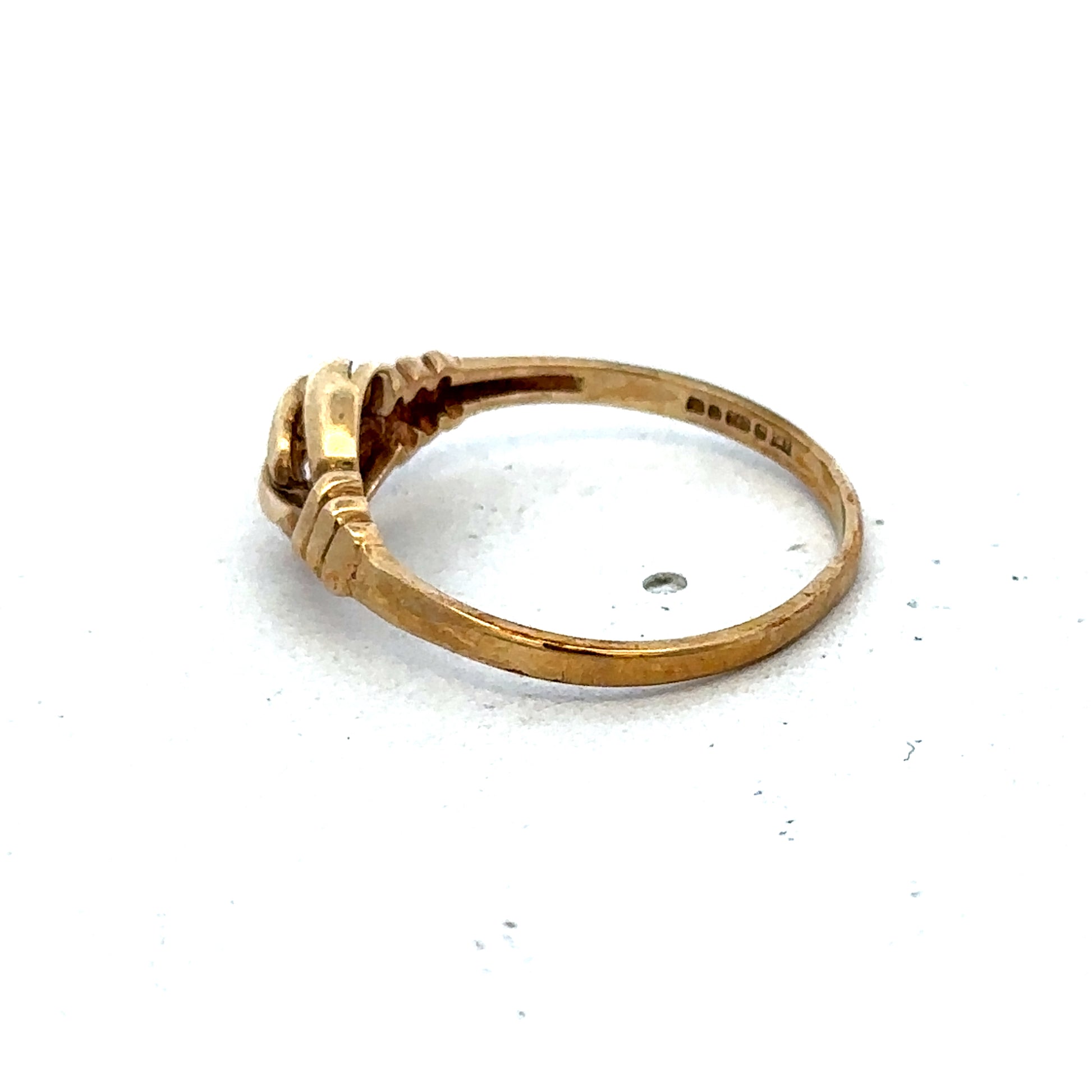 9ct yellow gold ring in size N with a smooth polished band, crafted by Reeves and Sons.