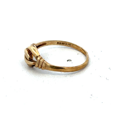 Reeves and Sons 9ct yellow gold ring size N with a smooth, polished band, shown close-up against a neutral background.