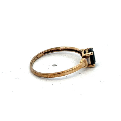 9ct yellow gold ring in size M with a smooth polished band, crafted by Reeves and Sons.
