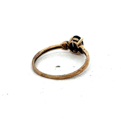 Yellow gold ring in size M by Reeves and Sons, showcasing a smooth, polished band with a classic design.