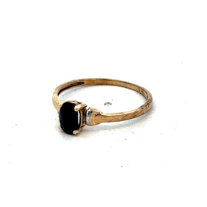 9ct yellow gold ring in size M by Reeves and Sons, featuring a smooth polished band on a white background.