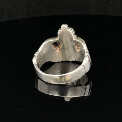Silver Claddagh ring size Z1 by Reeves and Sons, featuring traditional heart and crown design on a polished band.