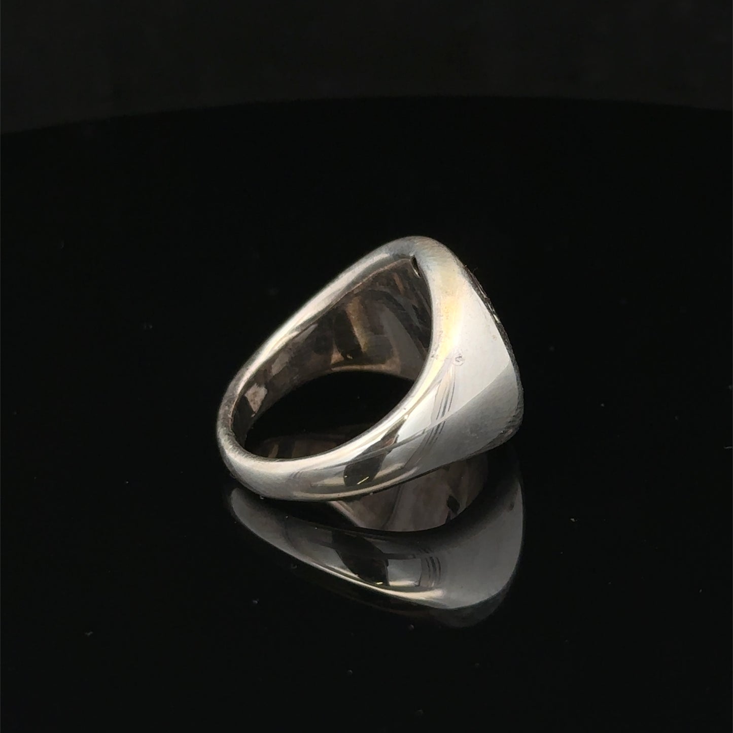 Silver ring size P from Reeves and Sons, detailed close-up showing smooth band and polished finish.