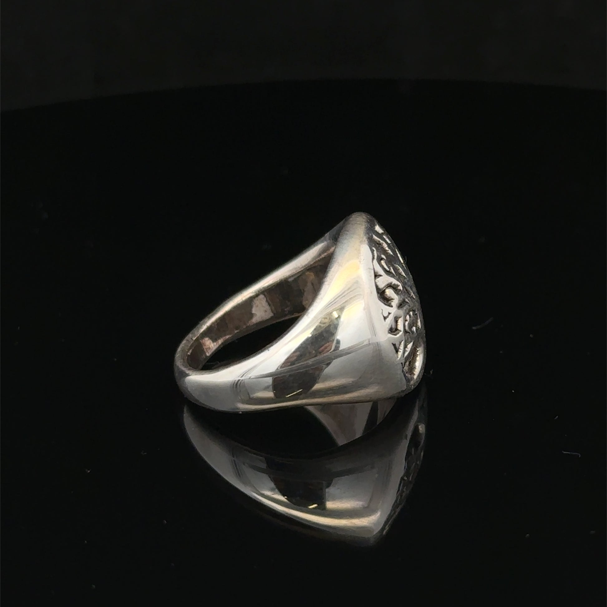 Silver ring size P by Reeves and Sons, featuring a polished band with a smooth finish and subtle shine.