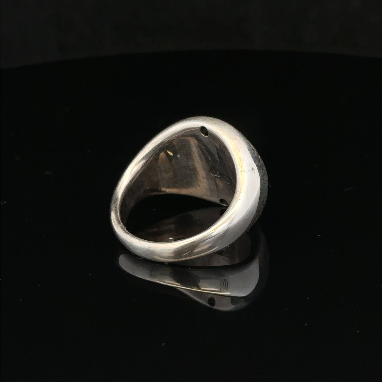 Silver ring size P by Reeves and Sons, featuring a polished band with a sleek, classic design.