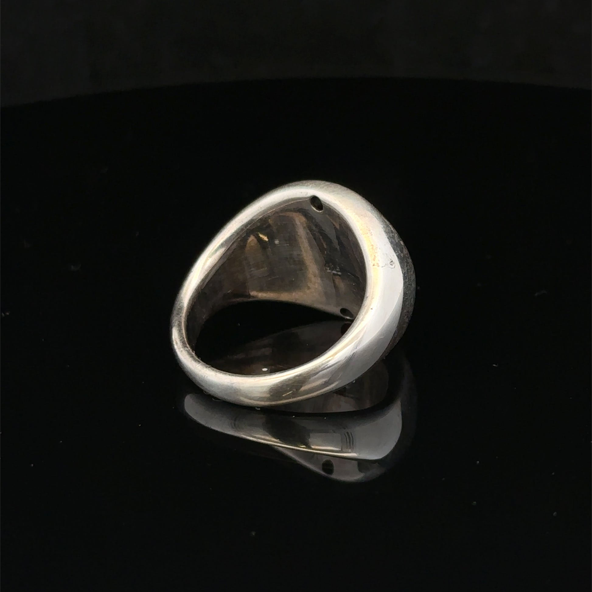 Silver ring size P by Reeves and Sons, featuring a polished band with a sleek, classic design.
