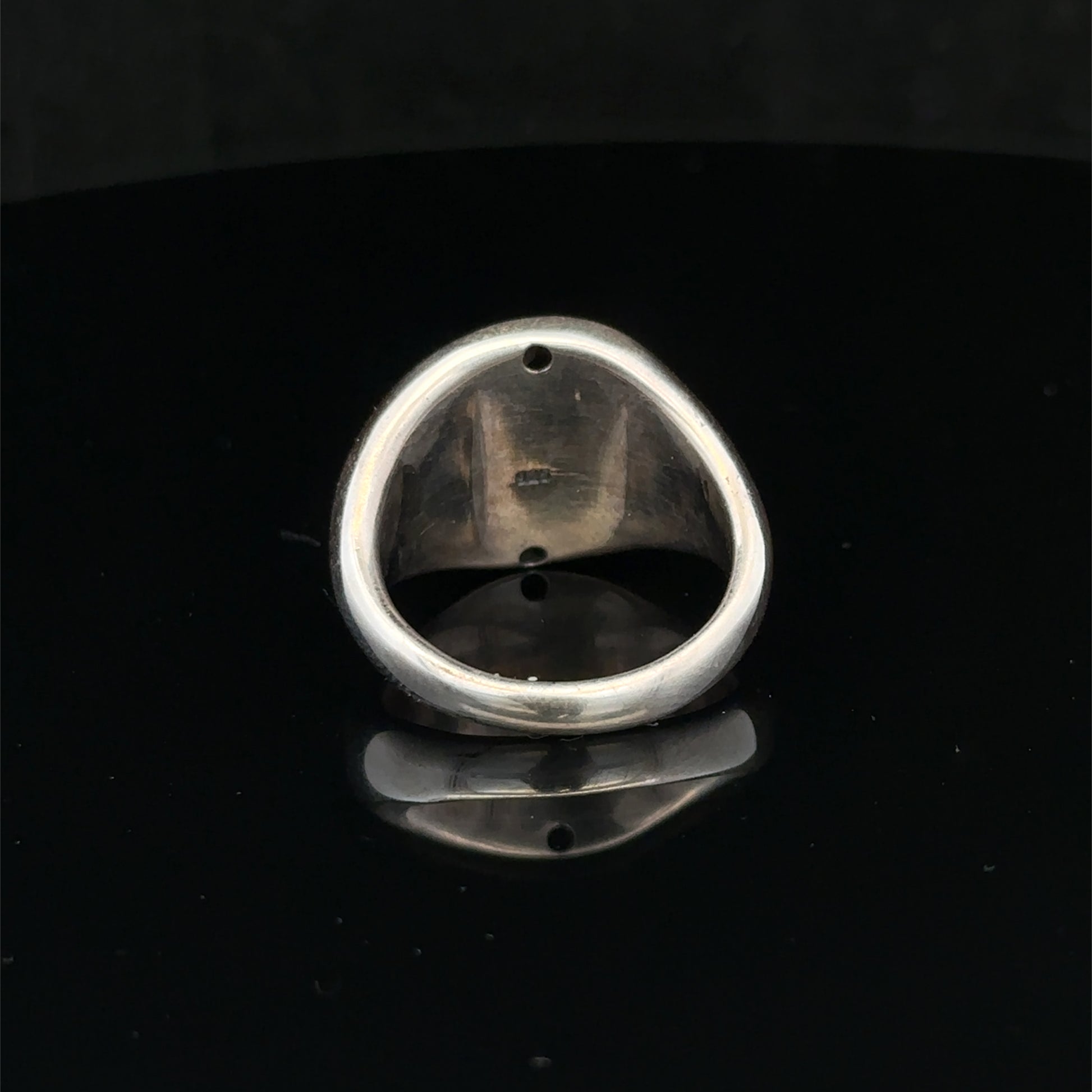 Silver ring size P by Reeves and Sons, featuring a smooth band design, shown on a neutral background.