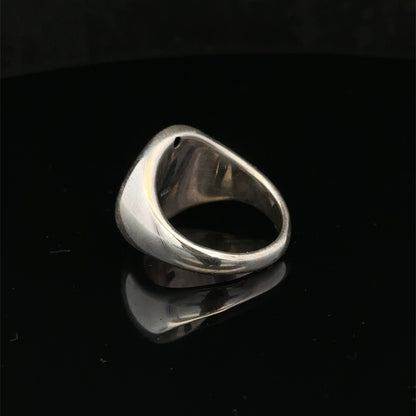 Silver ring size P by Reeves and Sons, featuring a polished band with intricate design details.