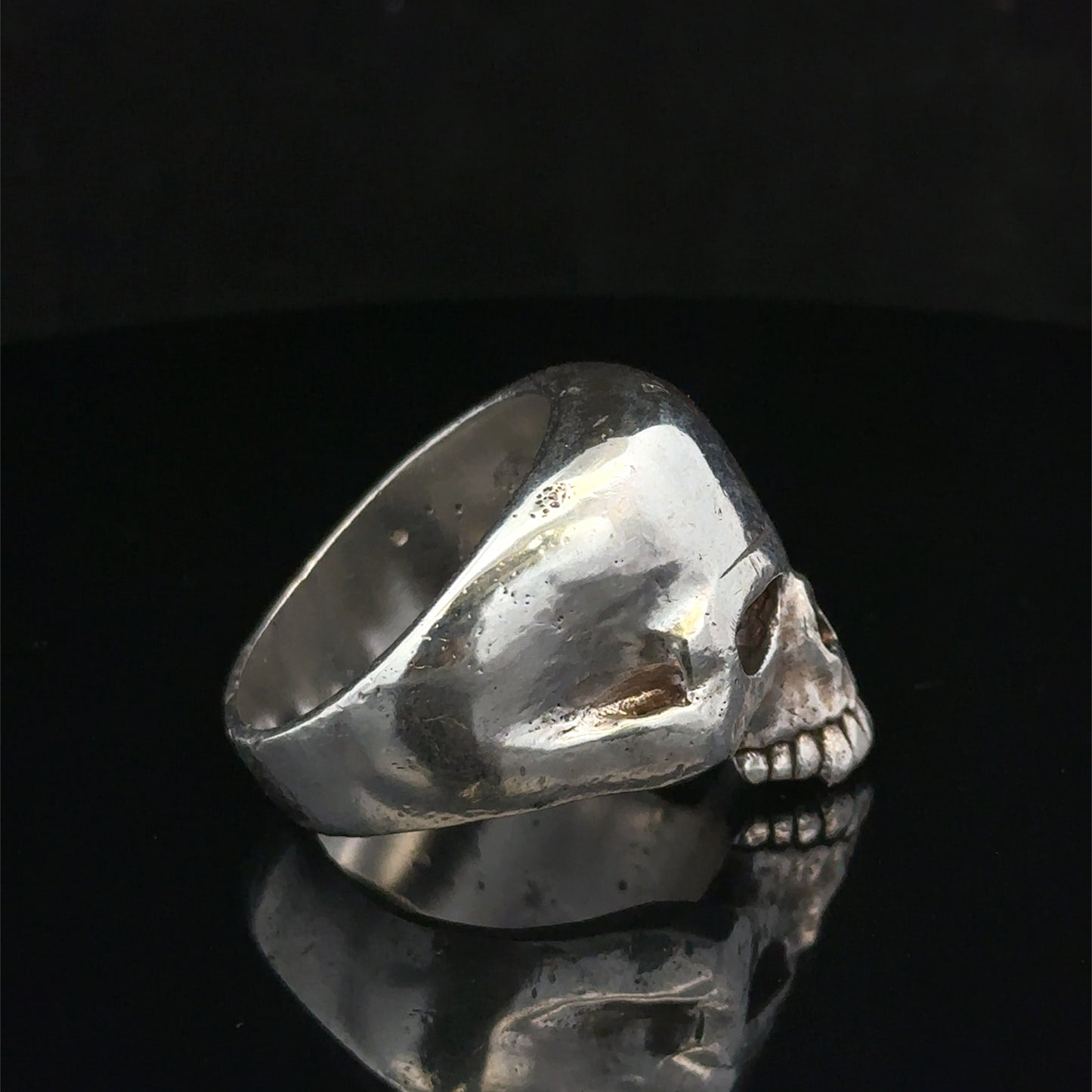 Silver skull ring with detailed design, size Z1 from Reeves and Sons, showcasing the gothic-style jewelry piece.