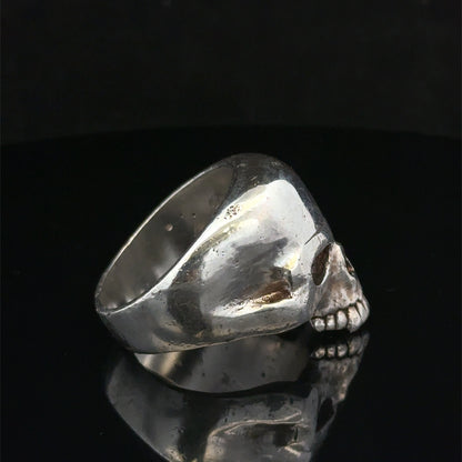 Silver skull ring with detailed design, size Z1 from Reeves and Sons, showcasing the gothic-style jewelry piece.