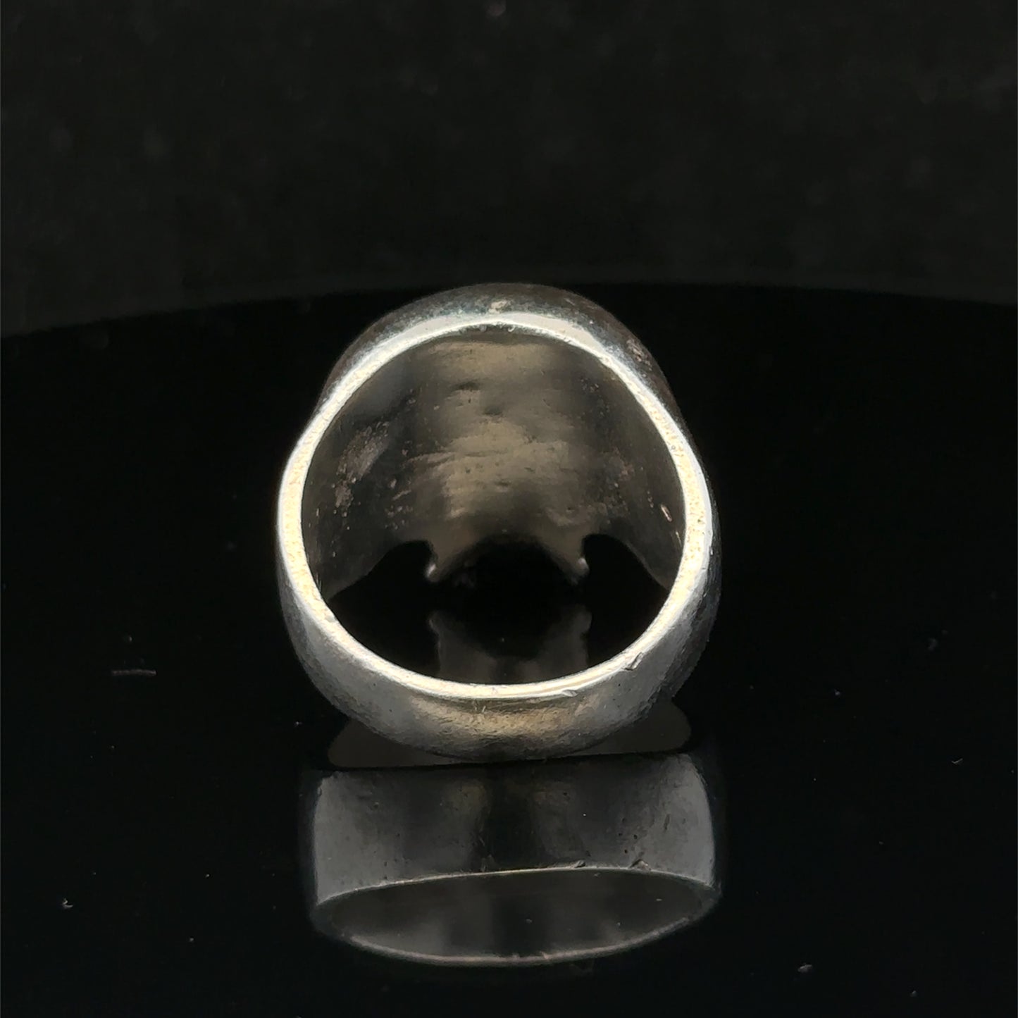 Silver skull ring from Reeves and Sons featuring a detailed skull design, size Z1, crafted in polished sterling silver.