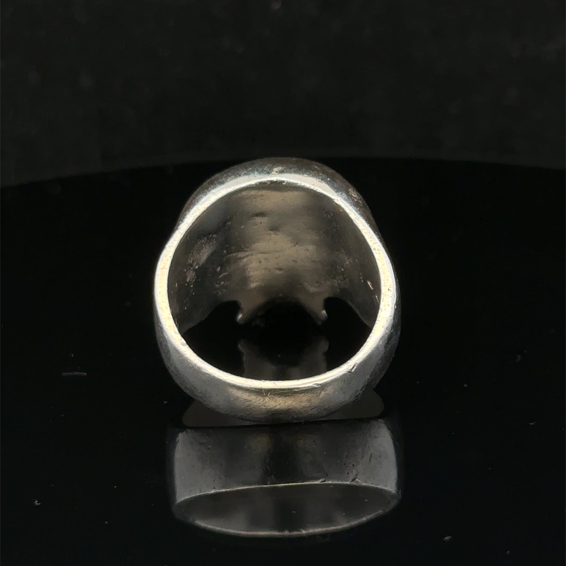 Silver skull ring from Reeves and Sons featuring a detailed skull design, size Z1, crafted in polished sterling silver.