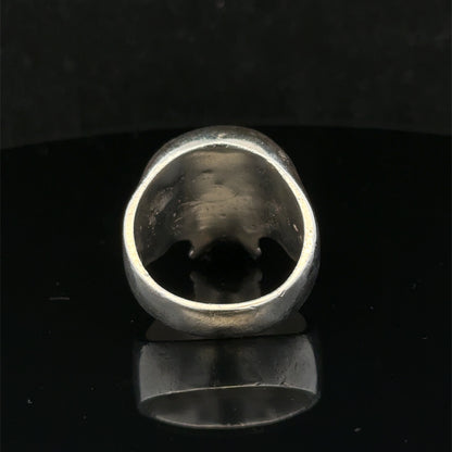 Silver skull ring from Reeves and Sons featuring a detailed skull design, size Z1, crafted in polished sterling silver.