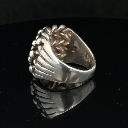 Silver keeper ring size Z1 by Reeves and Sons, showcasing a sleek, polished silver ring with intricate detailing.