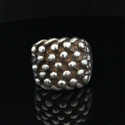 Silver keeper ring size Z1 by Reeves and Sons, showcasing a polished, detailed silver ring with intricate design.